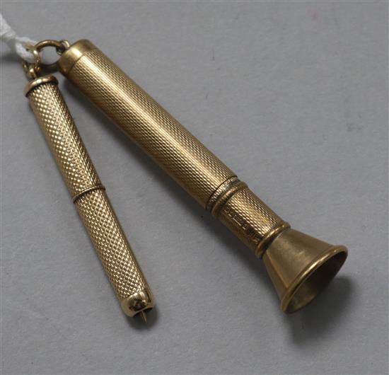 A 9ct gold cased cigar piercer and a 9ct gold propelling tooth pick.